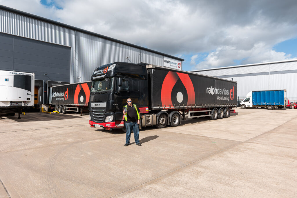 ralph davies employee standing in front of HGV